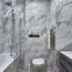 Ванная комната выполнена из мрамора с серыми прожилками. Дизайн и ремонт квартиры в ЖК «Альбатрос» — Литературный минимализм. Фото 028
