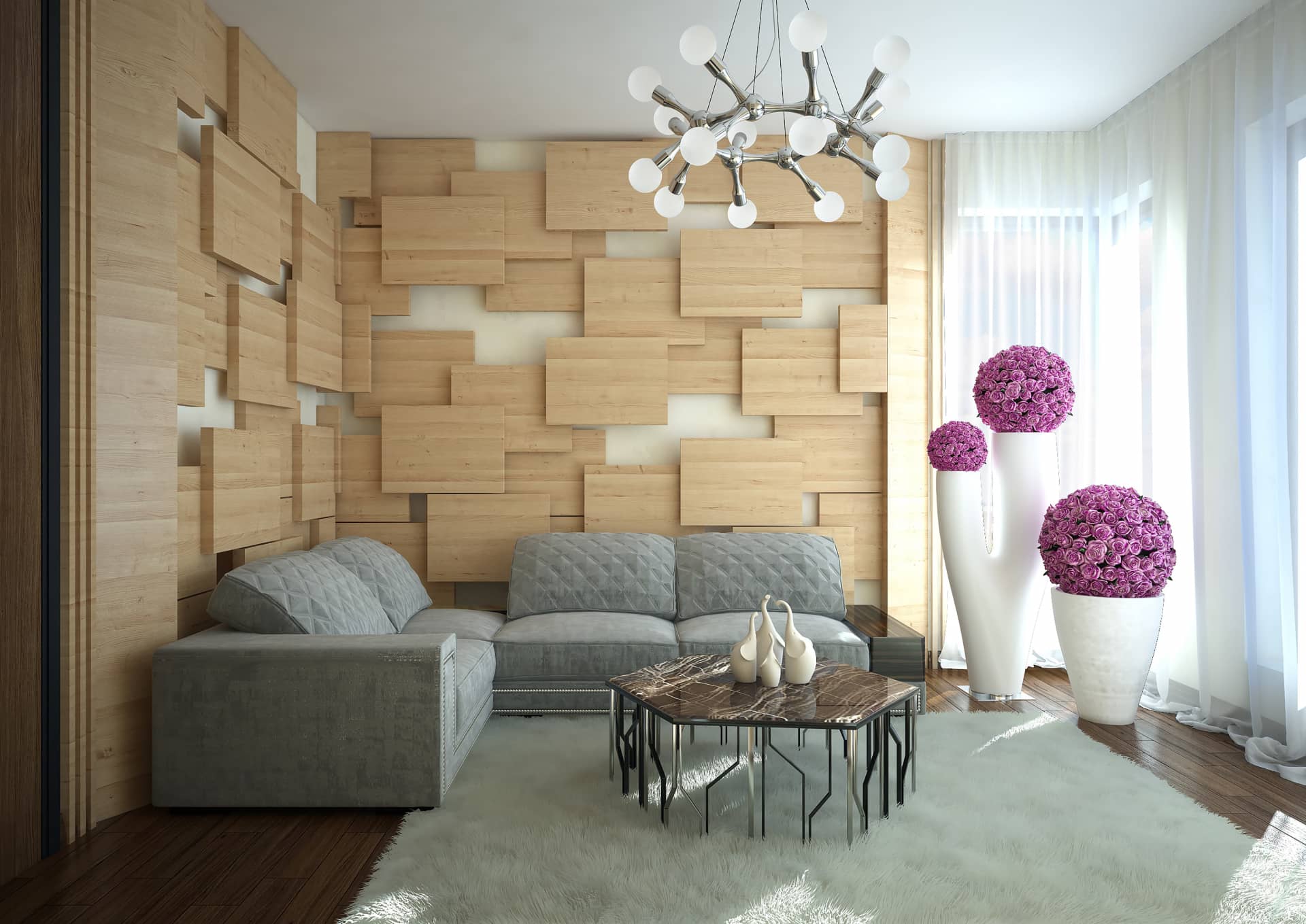 Длинный диван серебристого цвета с декоративными цветами малинового оттенка