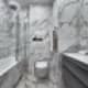Ванная комната выполнена из мрамора с серыми прожилками. Дизайн и ремонт квартиры в ЖК «Альбатрос» — Литературный минимализм. Фото 030