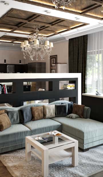 Диван с волнистой спинкой серебристого оттенка с тёмными подушками для гостиной