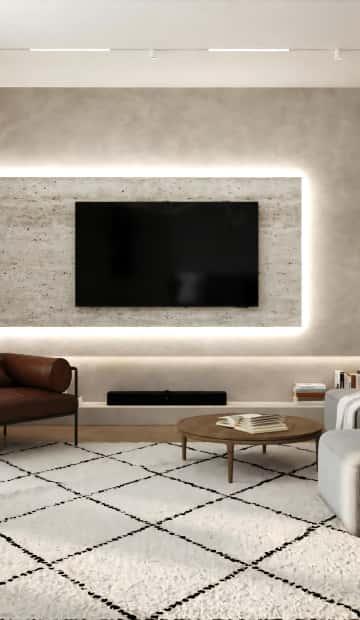 Стену за телевизором выделили серым декоративным покрытием из микроцемента