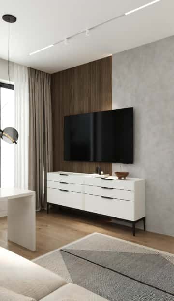 Область за телевизором наполовину закрыли деревянной панелью