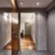 Небольшой коридор с серыми дверьми. Дизайн и ремонт квартиры в ЖК «Дубровская Слобода»  — Возвращение к простоте. Фото 01