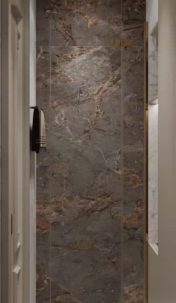 Душевую кабину выделили с помощью акцентной отделки стены