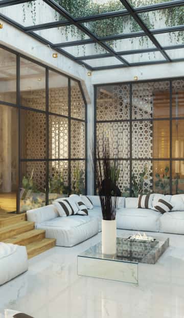 Диван белого цвета из ткани с подушками в чёрную полоску